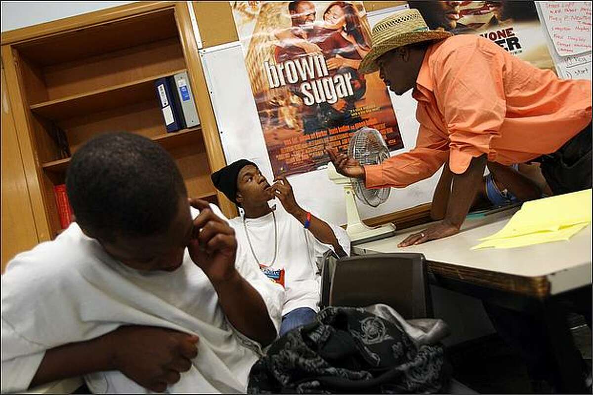 Guest speaker Galen Harper shares his street wisdom with participants of the Youth 180 gang intervention, including Taye Cheatham, center, during a meeting in south Seattle on Wednesday, August 6, 2008. The day before, a youth that Cheatham had grown up with, Pierre Lapoint, 16, was killed in a gang-related shooting, and Youth 180 staffers were concerned about Cheatham's reaction.
