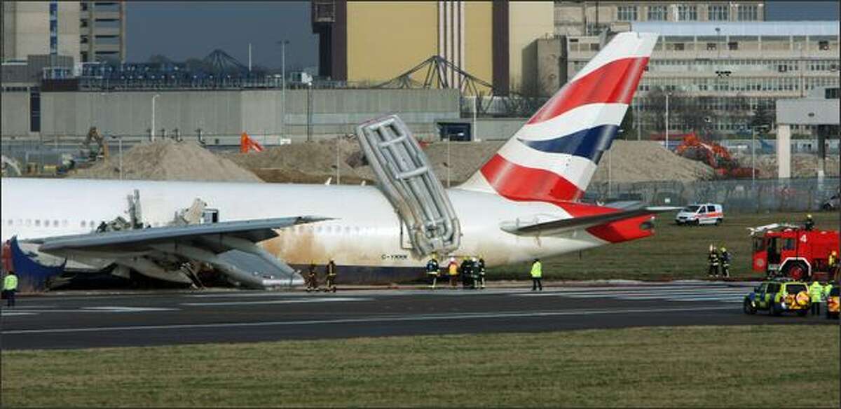 Emergency services surround a British Airways plane on Terminal 4 of Heathrow Airport in London, England.