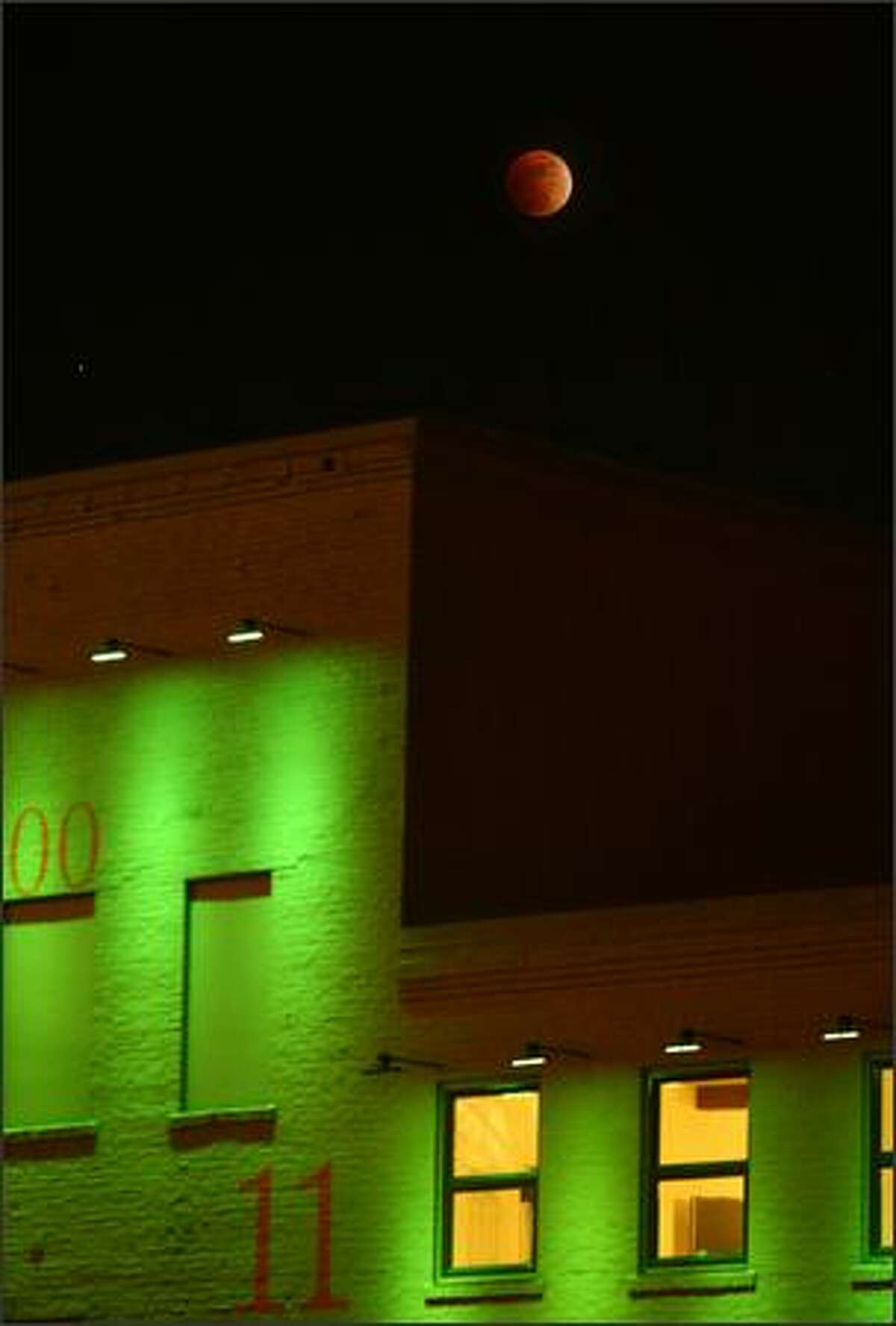 A lunar eclipse as seen above the X Gym building on Western Avenue in downtown Seattle Wednesday night, Feb. 20, 2008.