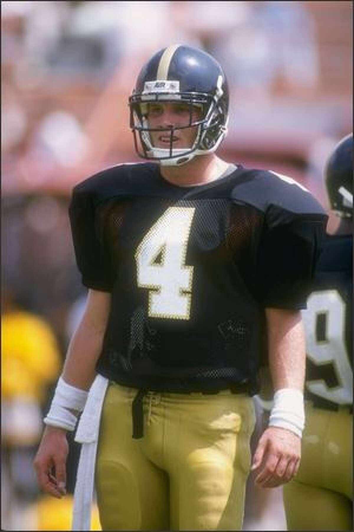 Quarterback Brett Favre, of the Southern Mississippi Golden Eagles, looks to the sideline during the Golden Eagles 30-26 victory over the Florida State Seminoles at Roberts Stadium in Hattiesburg, Mississippi, Sept. 2, 1989.