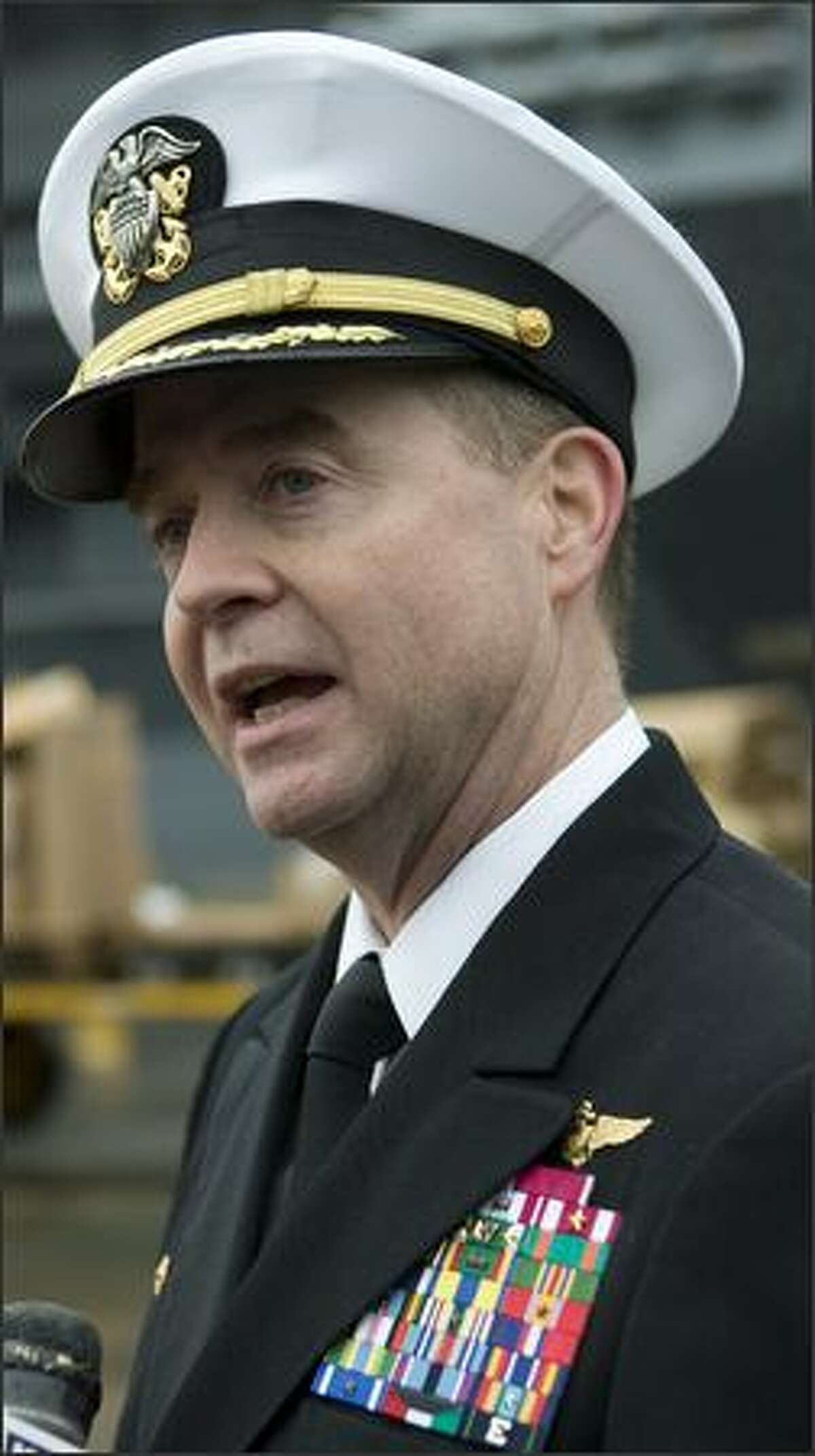 Captain Patrick D. Hall, Commanding Officer of USS Abraham Lincoln talks with members of the media just before the ship departs from Naval Station Everett in support of the global war on terrorism.