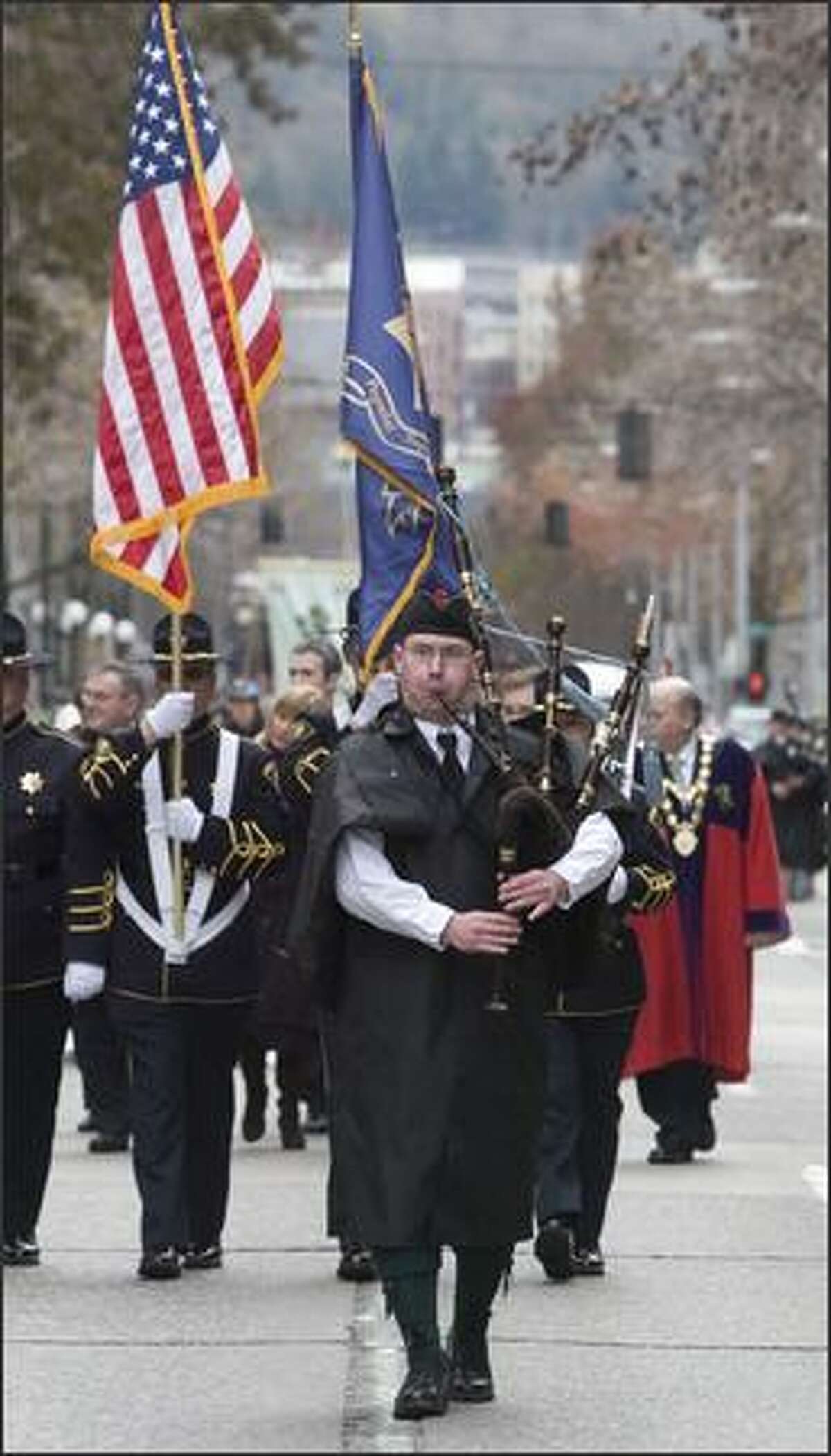 A bagpiper leads off the 37th annual St. Patrick's Day Parade in Seattle.