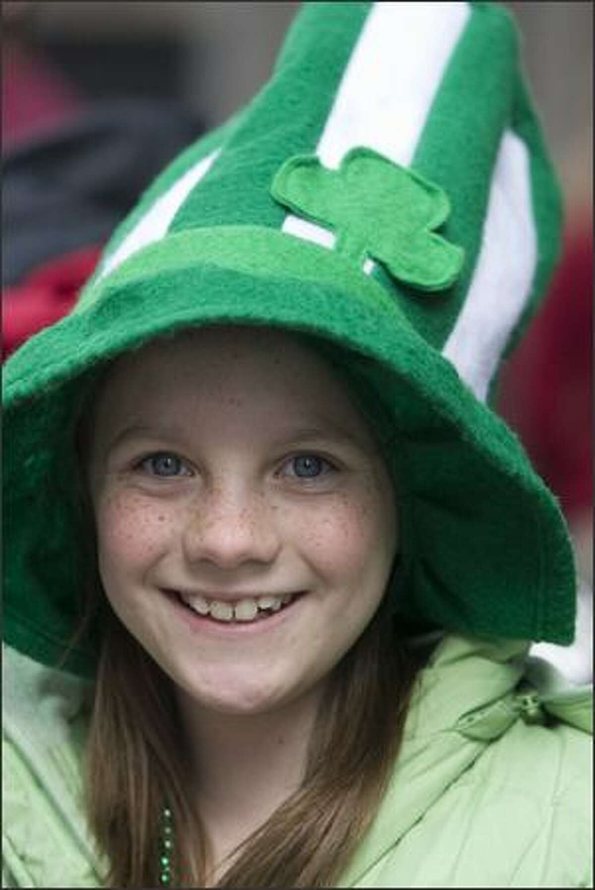 Elizabeth Nelson shows her Irish colors while watching the 37th annual St. Patrick's Day Parade Saturday in Seattle.