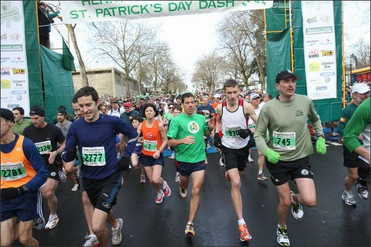 Runners explode off the starting line during the St. Patrick's Day Dash. The course is nearly 3.5 miles from Seattle Center to Qwest Field.