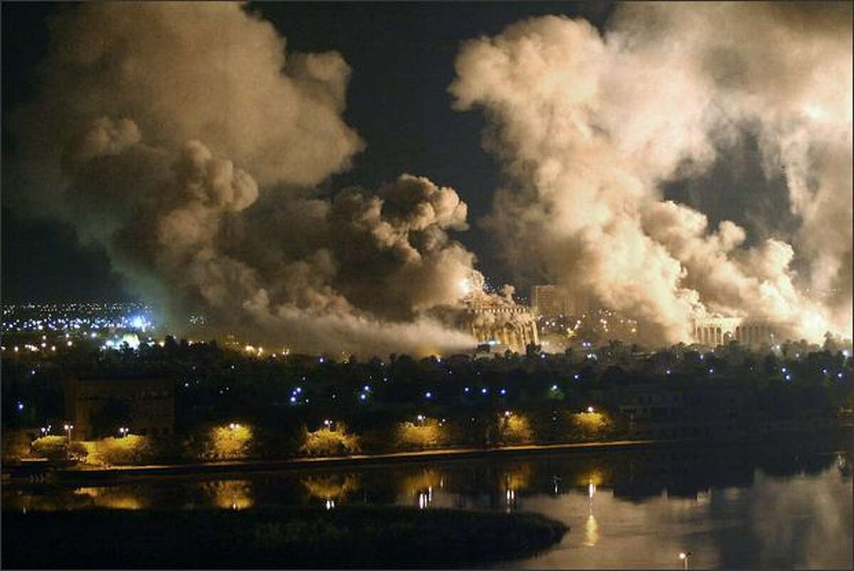 Smoke covers the presidential palace compound during a massive US-led air raid in Baghdad on March 21 2003. AFP PHOTO/Ramzi HAIDAR