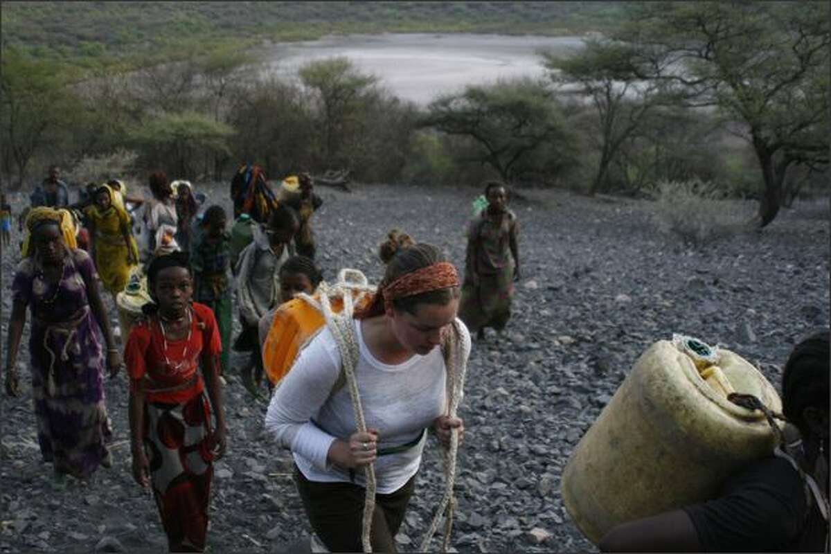 Sarah Stuteville, with Dillo water walkers on the walk out of salt crater. photos by Alex Stonehill