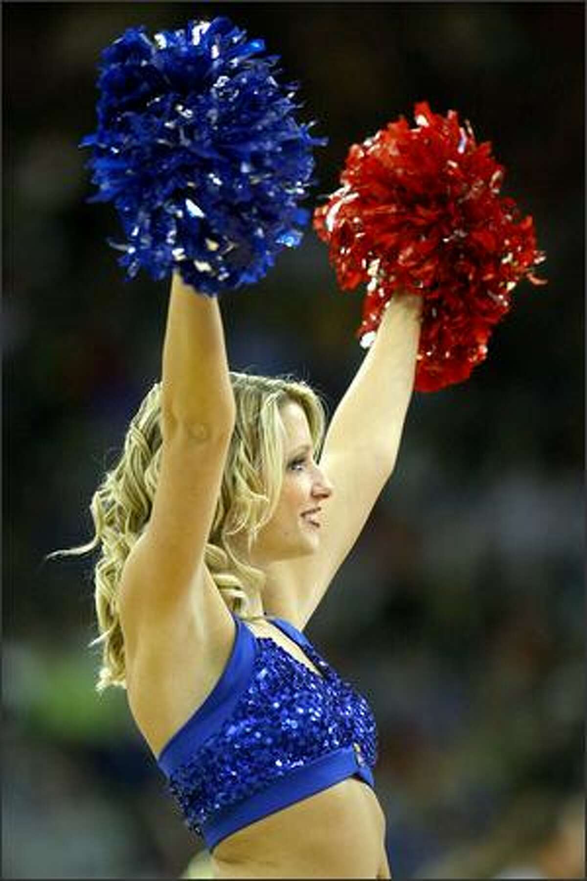 A cheerleader for the Kansas Jayhawks performs during the Midwest Region second round game against the UNLV Runnin' Rebels at the Qwest Center in Omaha, Neb.