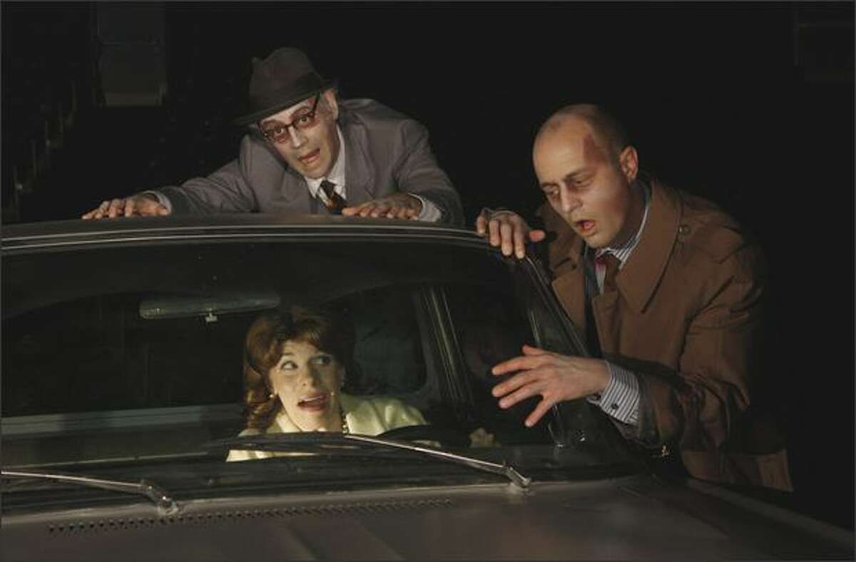 Zombies (Troy Fischnaller, left, and Galen Joseph Osier) hassle Barbara (Sarah Harlett).