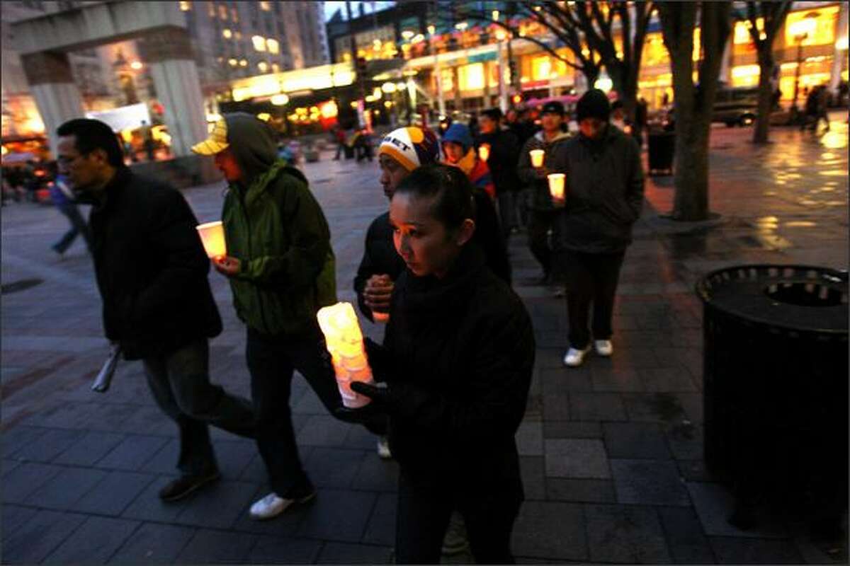 Tibet supporters participate in a candle light vigil and prayer march at Westlake Plaza in Seattle on the declared world-wide day of Support for Tibet, the day that the Olympic Torch arrives in Beijing. The event was sponsored by the Tibetan Association of Washington.