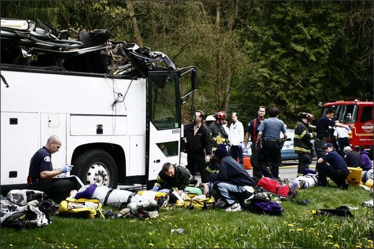 A charter bus carrying the Garfield High School girls' softball team smashed into an overpass in Seattle, destroying the roof and slightly injuring at least five students. The bus was carrying 24 Garfield High School students, their coach and a driver, said Seattle Fire Department spokeswoman Helen Fitzpatrick.