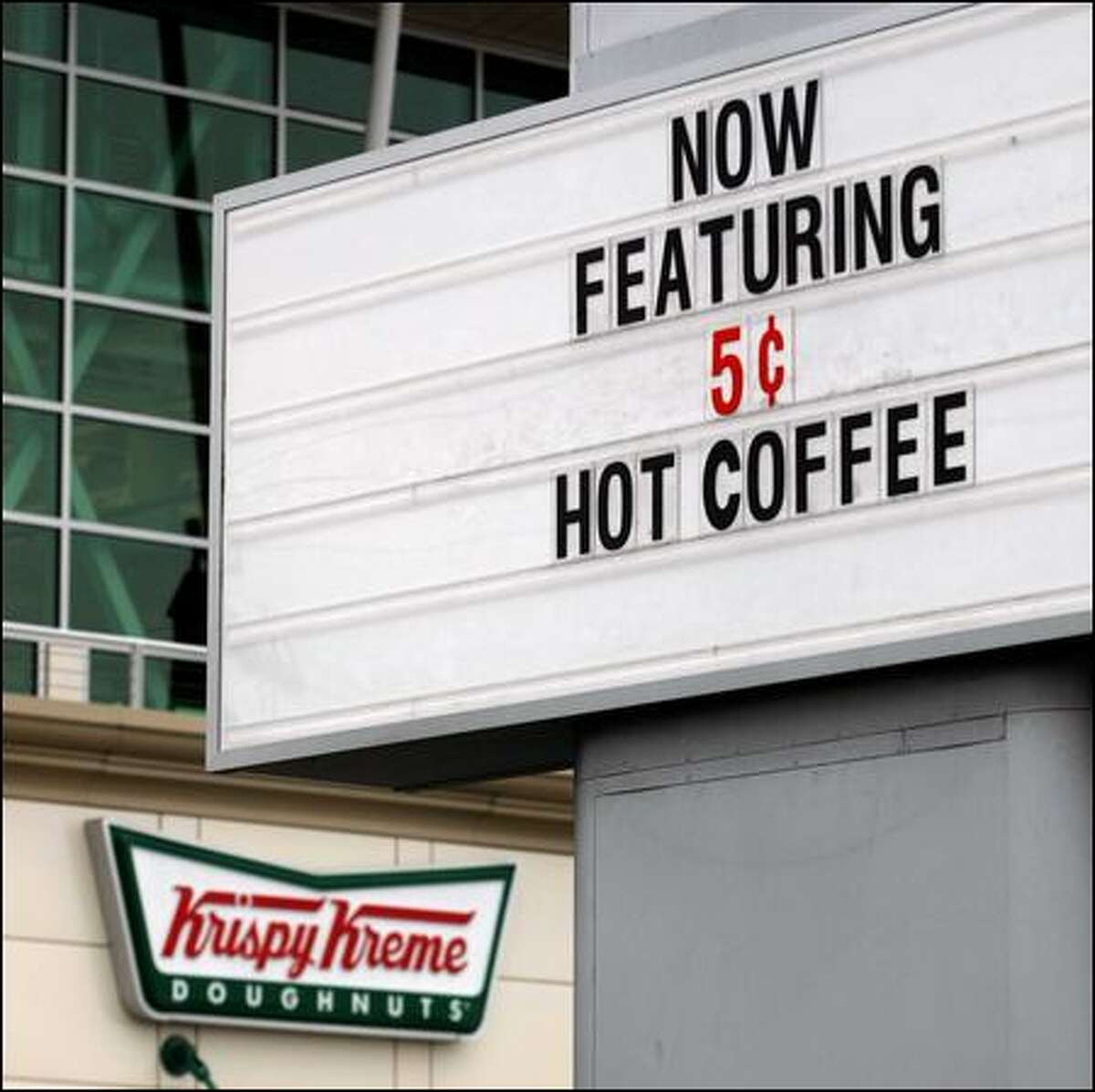 The popular doughnut chain advertises its 12-ounce coffee for 5 cents as part of its New Deal promotion.