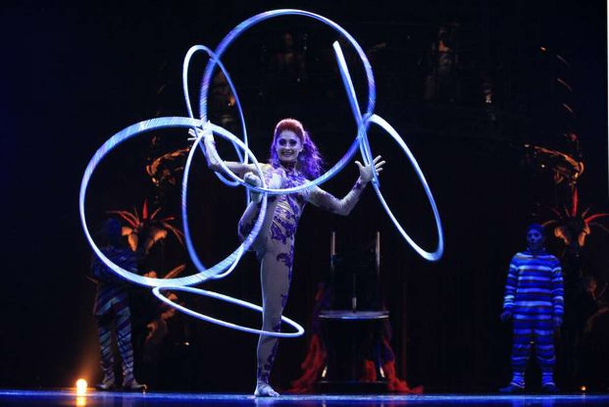 Irina Akimova twirls with seven hoops during a performance of Cirque du Soleil's KOOZA.