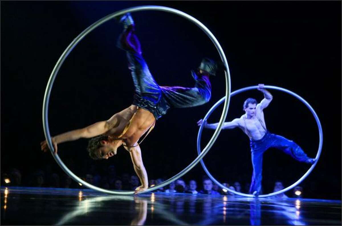 Members of Cirque Du Soleil perform the Cyr Wheel.