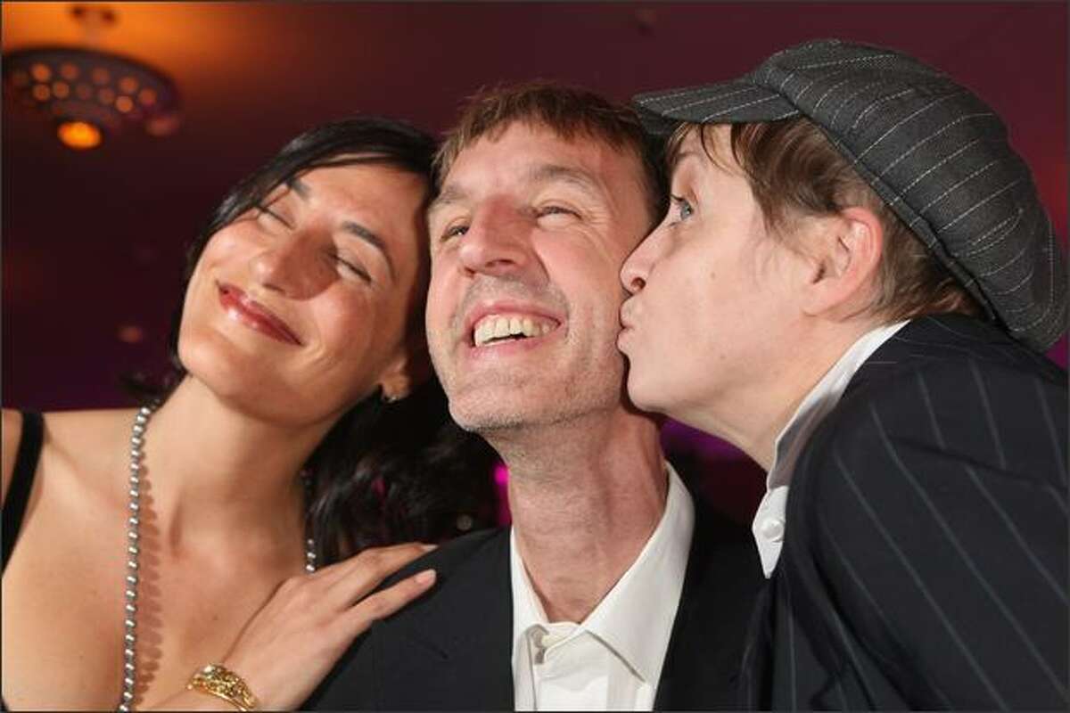 Actor Anndreas Schmidt gets a kiss from actress Katharina Thalbach (R) and attention from his girlfriend Jennifer at the afterparty at the German Film Award 2008 (Deutscher Filmpreis 2008) at the Palais am Funkturm on Friday in Berlin, Germany.