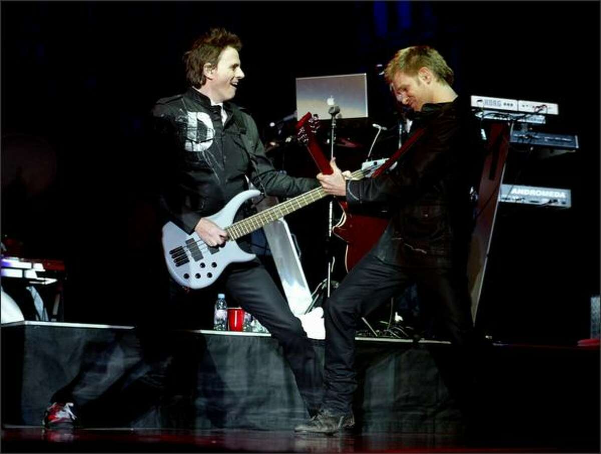 John Taylor bass guitar left and Dominic Brown lead guitar right with Duran Duran perform at the WaMu Theater in Seattle. [Note: This cutline has been changed since it was originally published.]