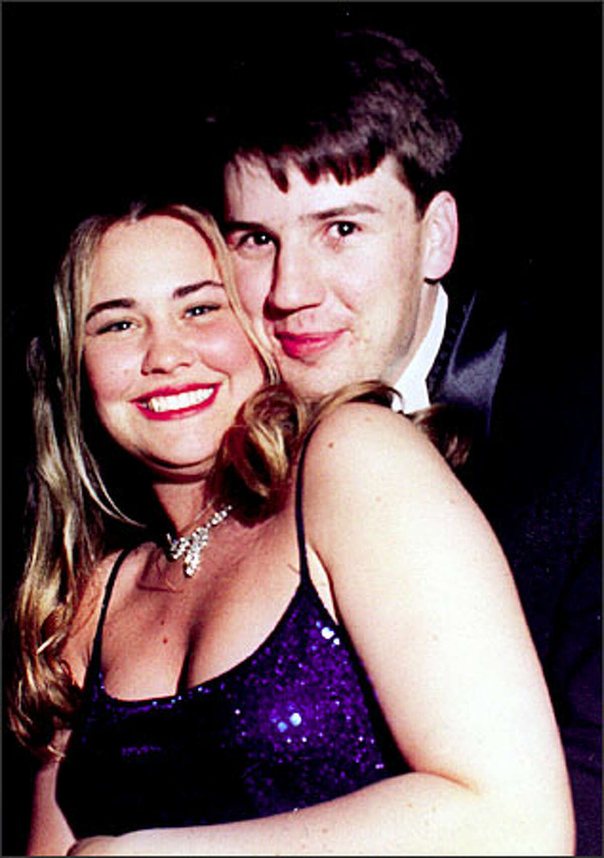 Kellie and Jason Cosner in a high school prom photo. The two were married about two years ago.