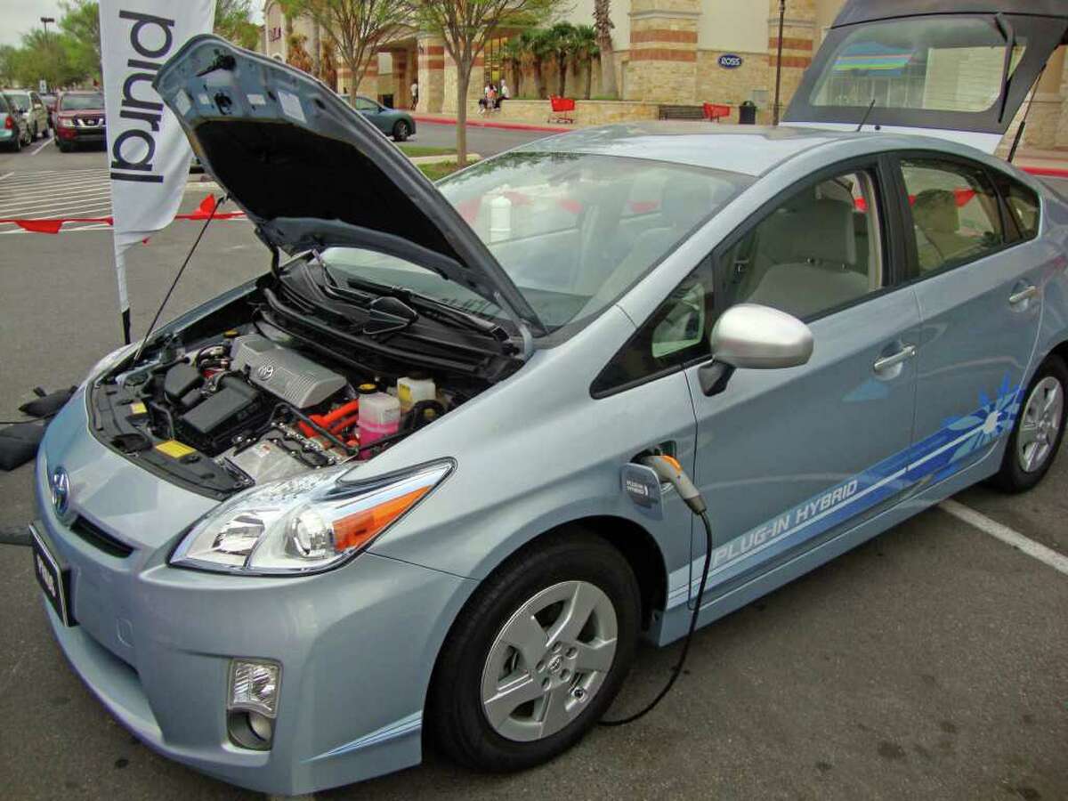 The new Toyota Prius PHV is a plug-in hybrid that can run up to 18 miles on battery power alone between recharges and can be charged in three hours with regular 110-volt household current. This one was on display recently at The Rim shopping center.