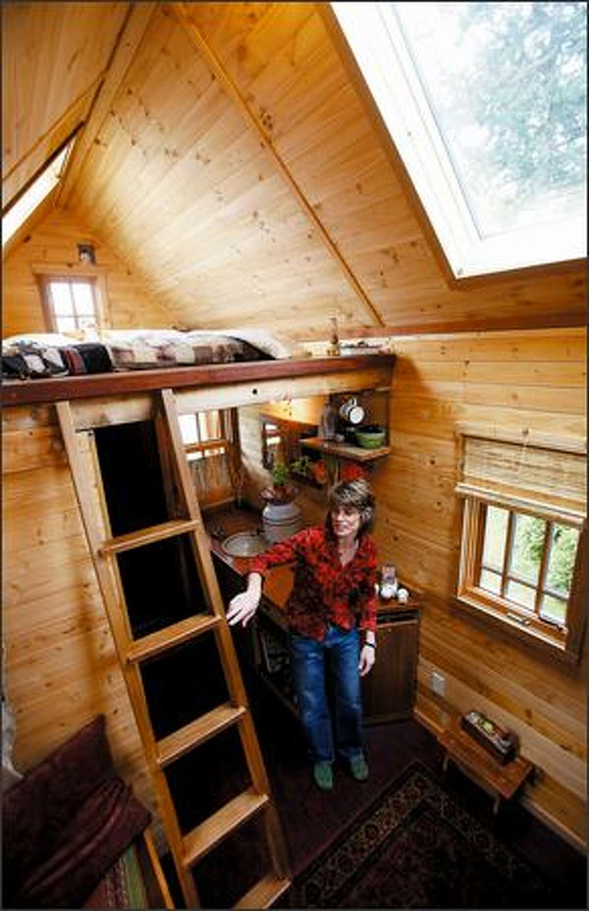 Dee Williams lives in a 7-by-12-foot Tumbleweed Tiny House in Olympia that was built for $10,000, including solar panels, ecofriendly denim insulation, high-quality wood windows and a trailer.