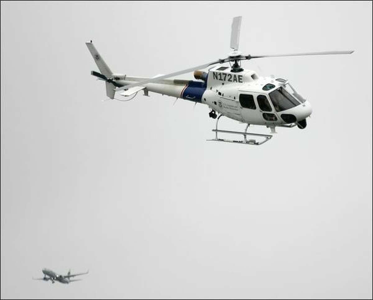 A U.S. Customs and Border Protection helicopter flies in to the American Heroes Air Show, Saturday, June 14, 2008. This is the fourth year the show has been in Seattle, with about 15 aircraft on display to the public.