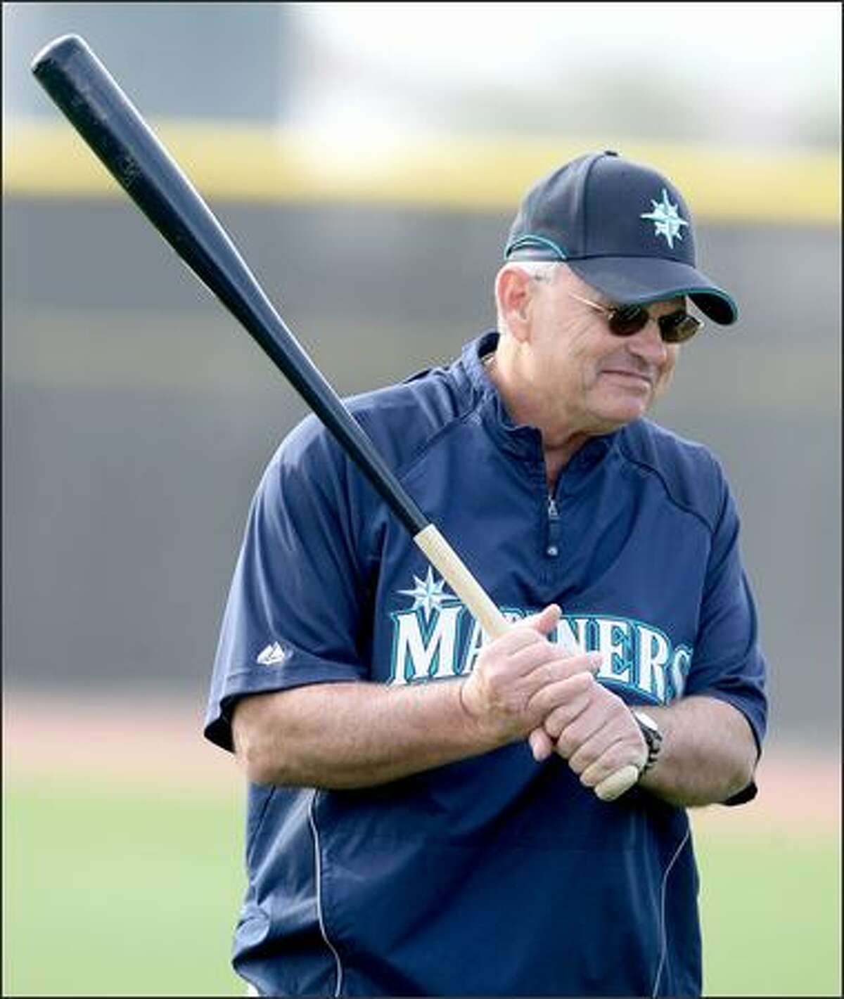 Mariners' manager John McLaren carries around a big stick at the first full squad workout of the Seattle Mariners at the Mariners training facility in Peoria, Ariz. on Wedday February 20, 2008.