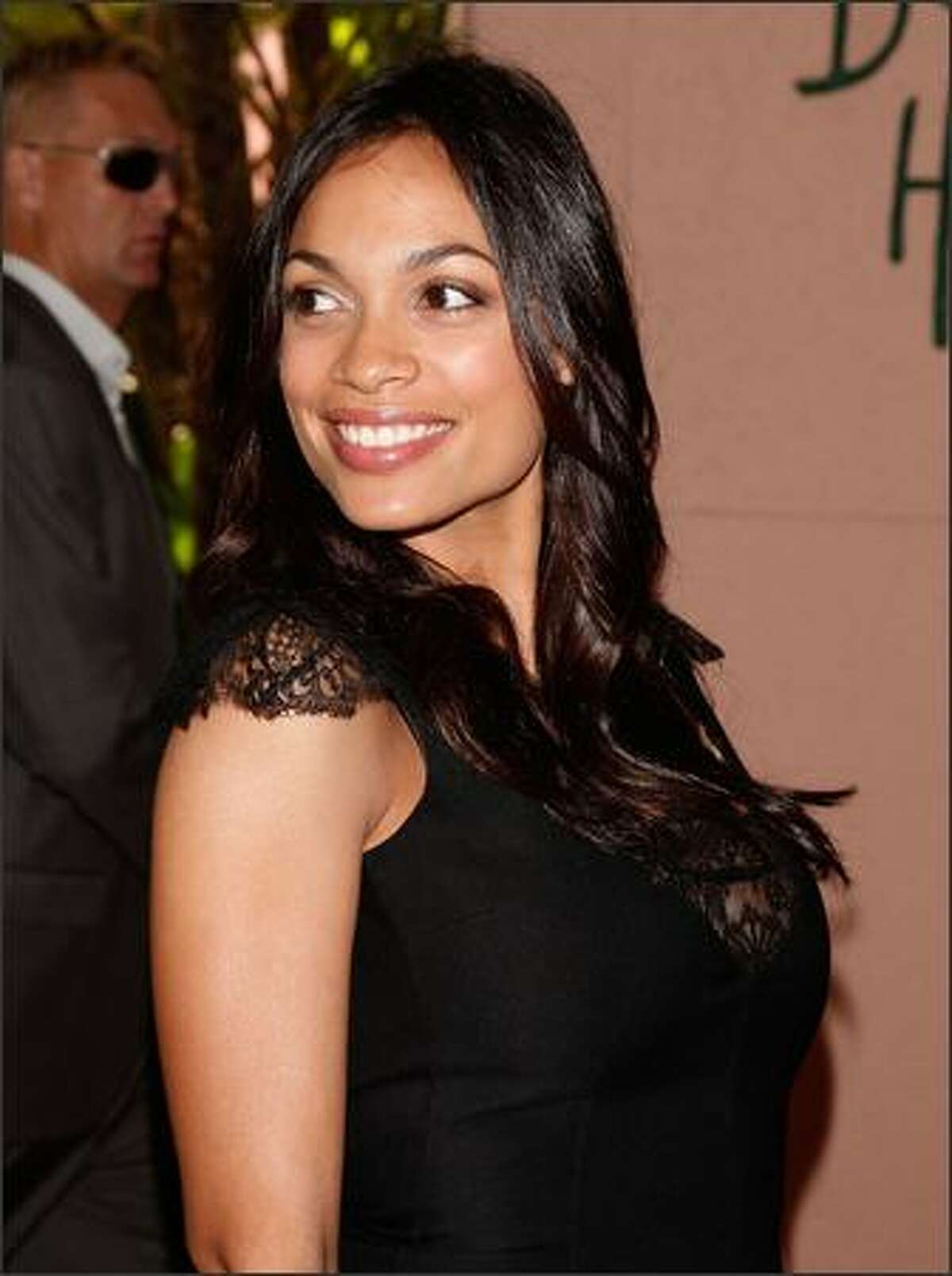 Actress Rosario Dawson arrives at the Hollywood Foreign Press Association's annual summer luncheon held at the Beverly Hills Hotel on Wednesday in Beverly Hills, Calif.