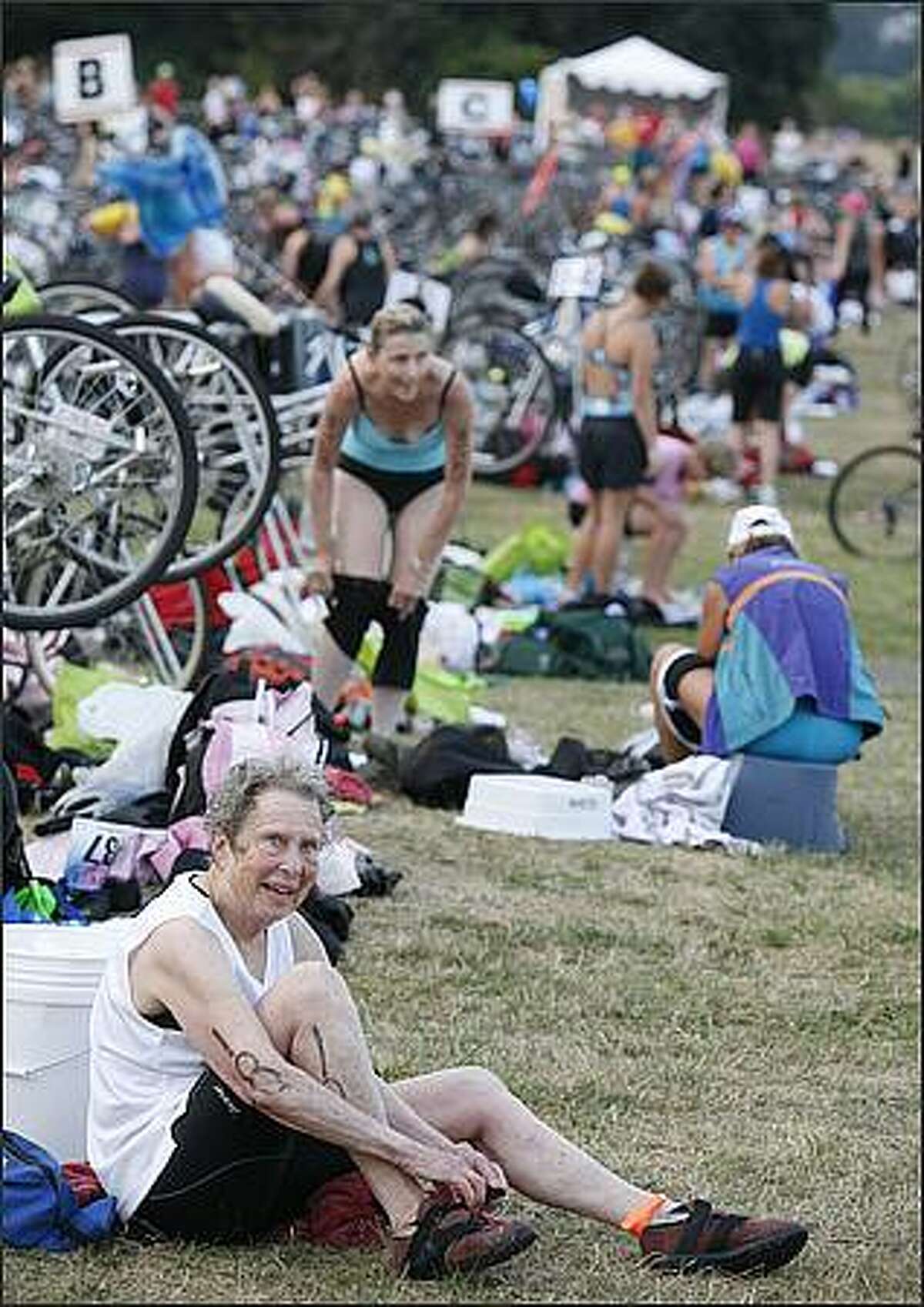 Athletes make the transition from swimming to biking in the 2008 Danskin Triathlon.
