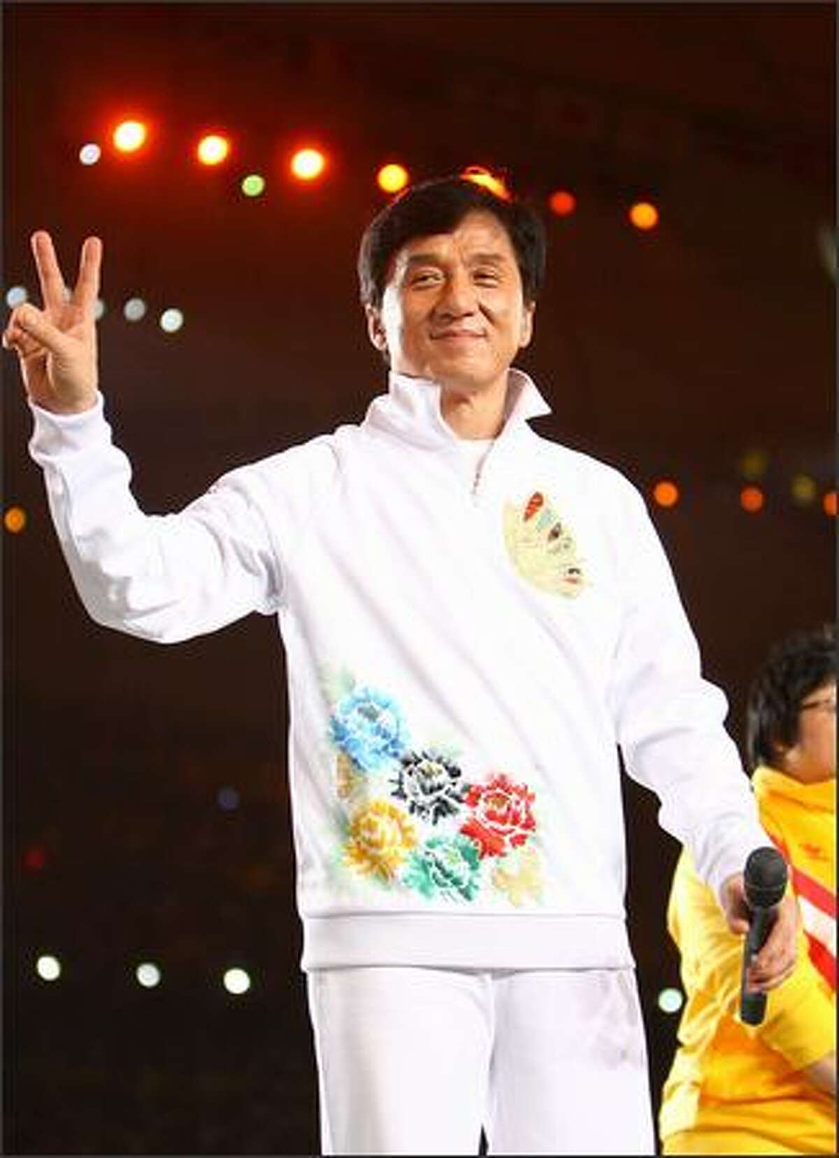 Hong Kong actor Jackie Chan waves to the crowd during the Opening Ceremony for the 2008 Beijing Summer Olympics at the National Stadium on August 8, 2008 in Beijing, China. (Photo by Jeff Gross/Getty Images)