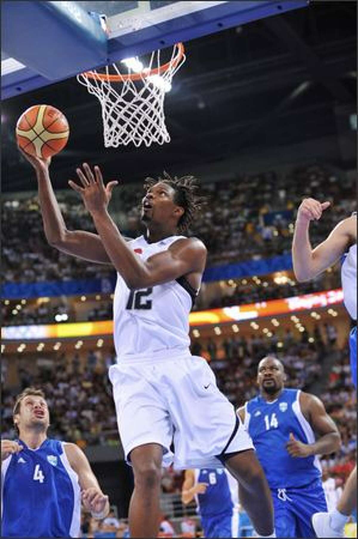 Chris Bosh #12 of the U.S. Men's Senior National Team shoots against Greece during a men's preliminary basketball game at the 2008 Beijing Olympic Games at the Beijing Olympic Basketball gymnasium on Thursday in Beijing, China.