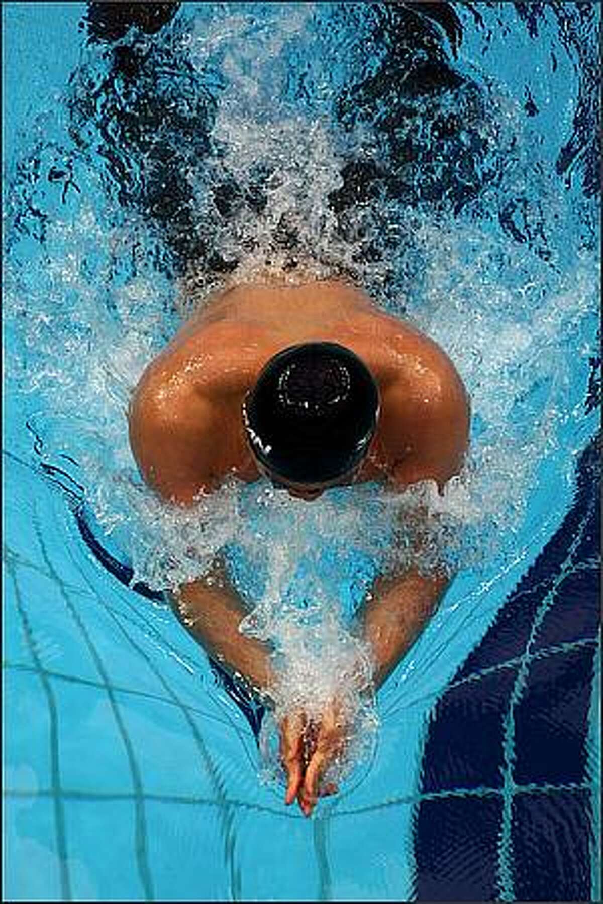Kosuke Kitajima of Japan competes in the Men's 200m Breaststroke Final at the National Aquatics Centre during Day 6 of the Beijing 2008 Olympic Games in Beijing, China. Kosuke Kitajima of Japan finished the race in a first place in a time of 2.07.64 a new Olympic Record. (Photo by Mike Hewitt/Getty Images)