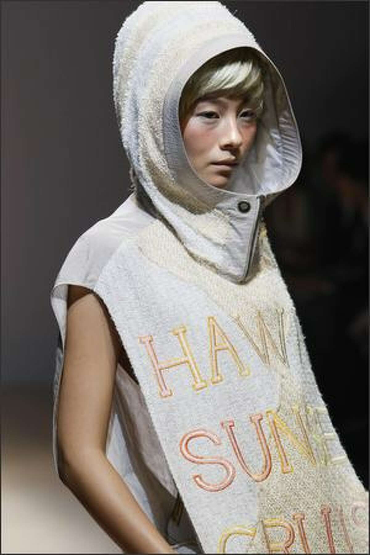A model displays a creation during the Mikio Sakabe 2009 spring/summer collection, designed by Mikio Sakabe and Shueh Jen-Fang of Taiwan in Tokyo at Japan Fashion Week on Monday in Tokyo.