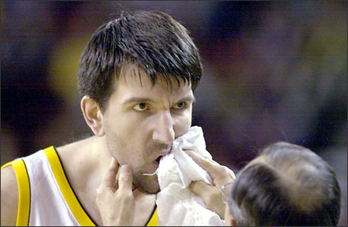 Sonics center Predrag Drobnjak receives treatment for a slight cut on his lip during the first half. He remained in the game.