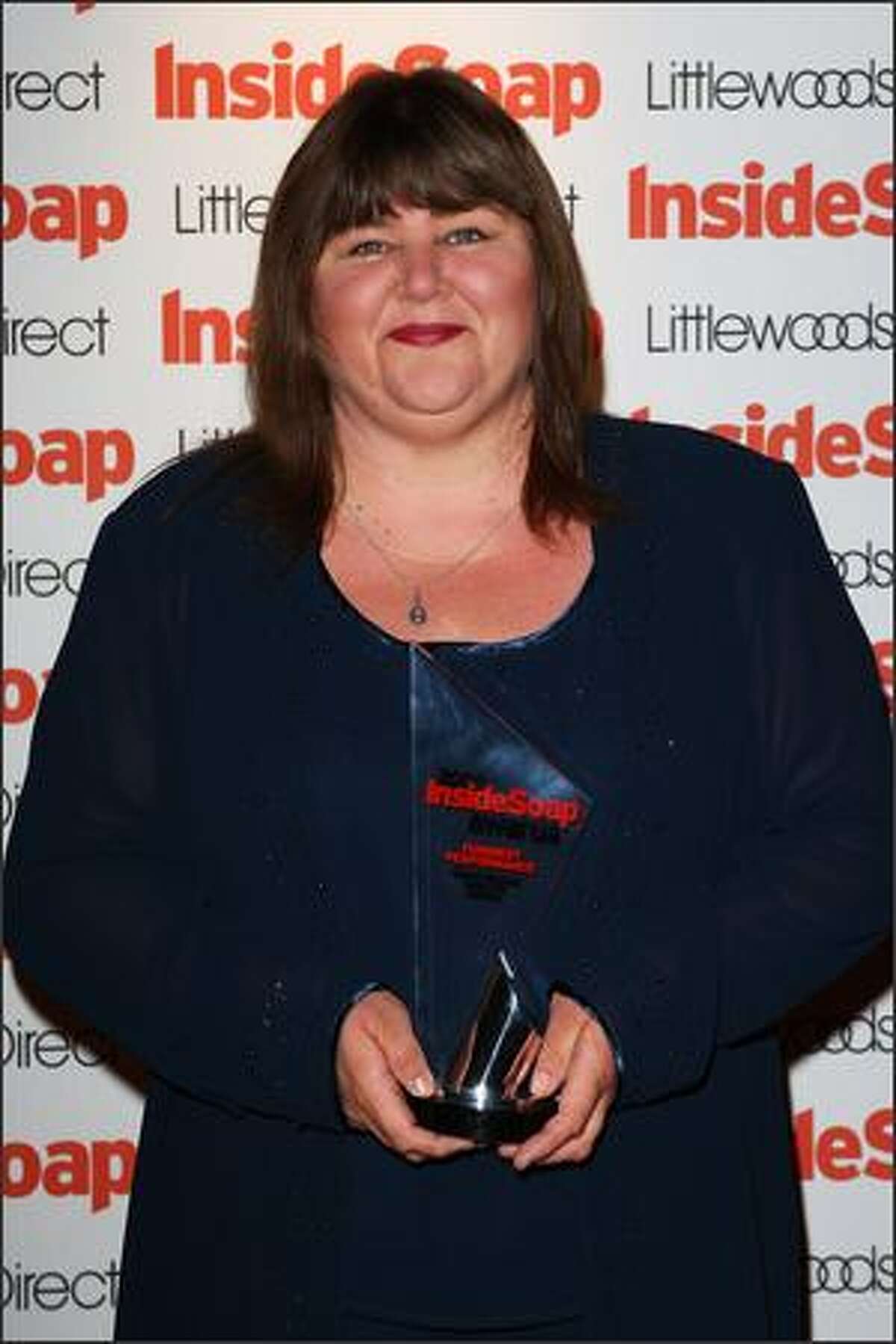 Actress Cheryl Ferguson poses in the press room with her award for Funniest Performance at the Inside Soap Awards 2008 at Gilgamesh, Camden Lock on Monday in London, England.