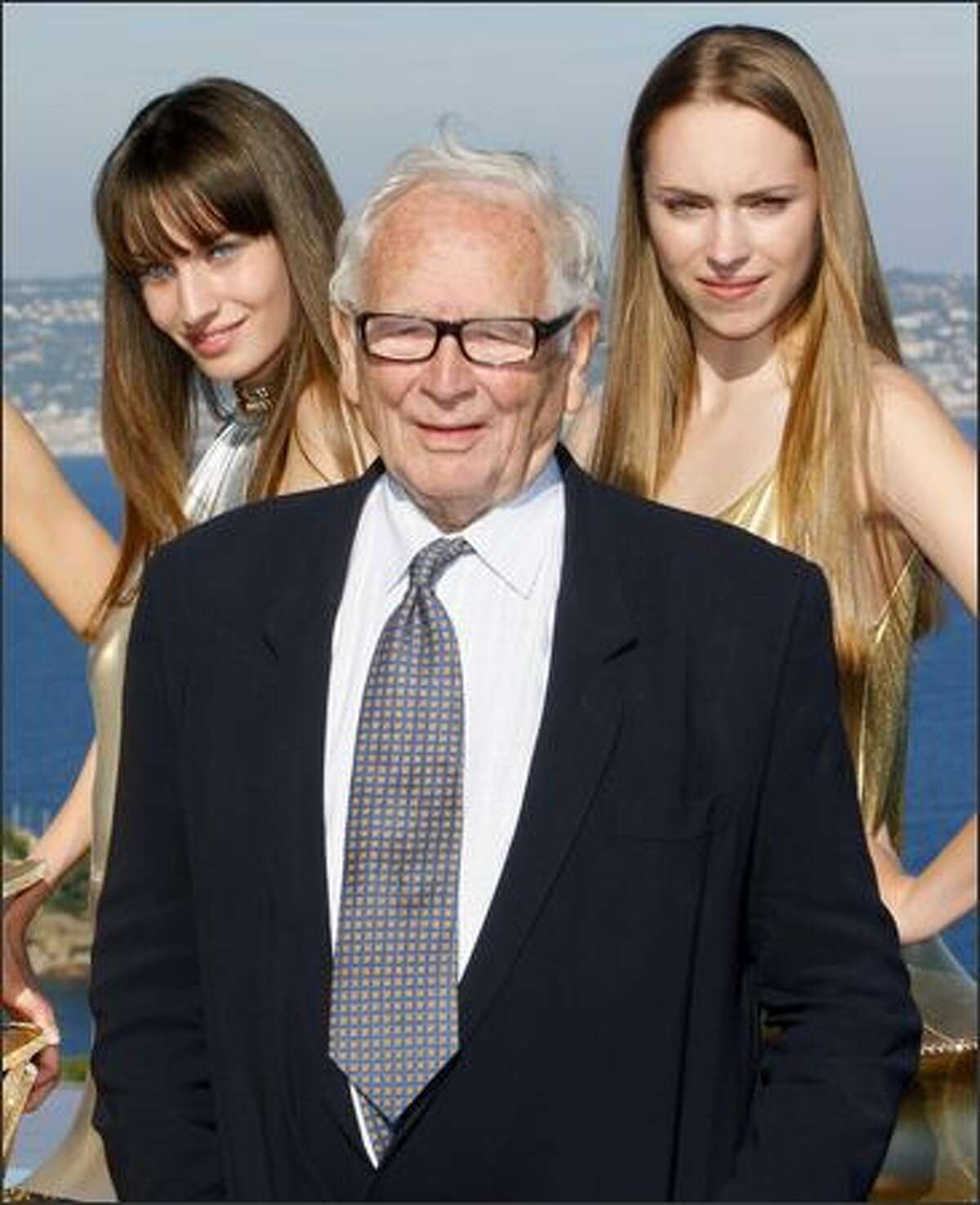 French designer Pierre Cardin poses with models after is spring/summer 2009 ready-to-wear collection show in Theoule-Sur-Mer, southern France, on Monday.