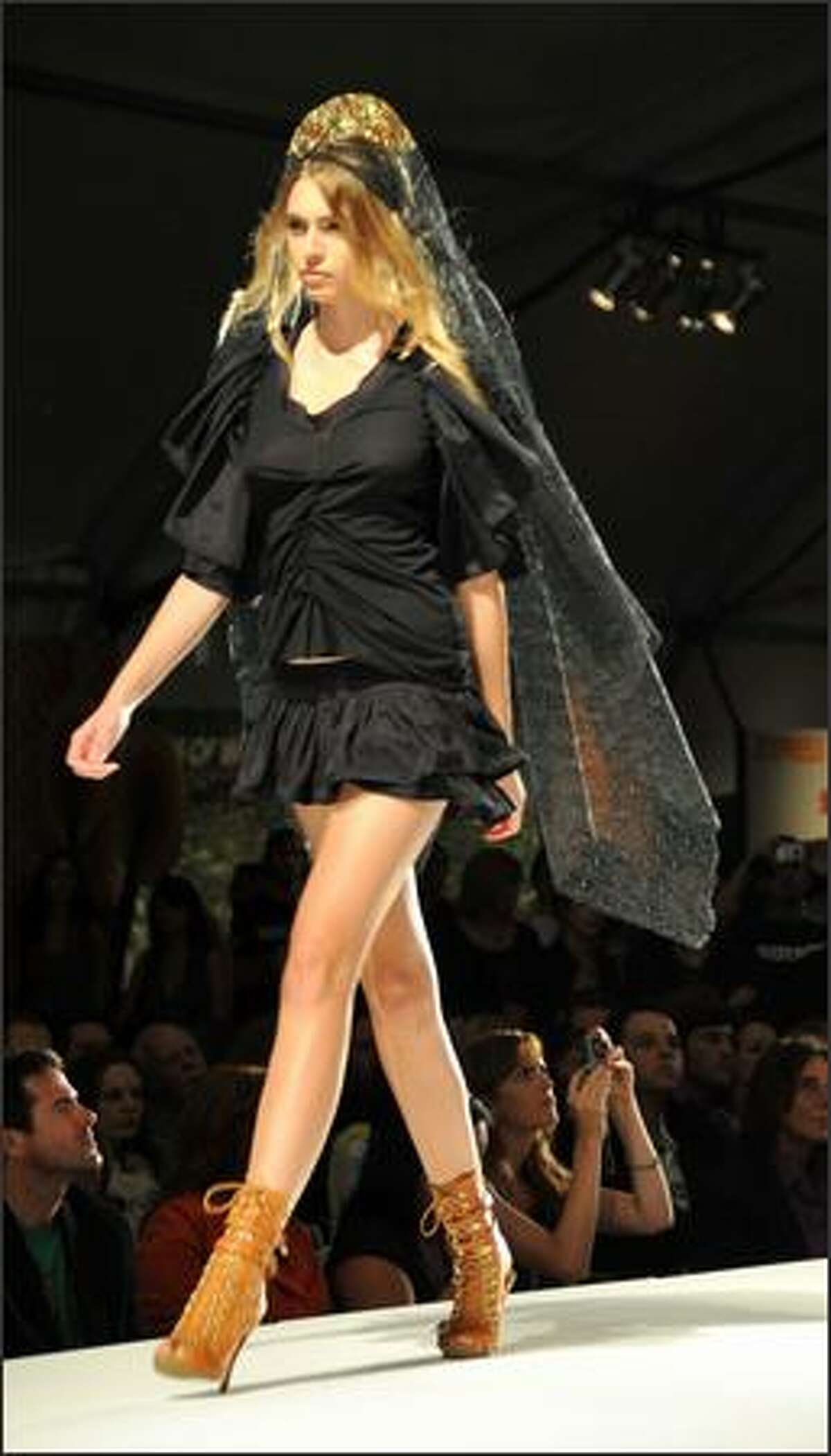 A Moidel walks the runway at the Gen Art & Soy Joy Presents "Fashionably Natural" fashion show to kick of Los Angeles Spring 2009 Fashion week hosted by Maggie Gyllenhaal, on Thursday at the Petersen Automotive Museum, Los Angeles, Calif.