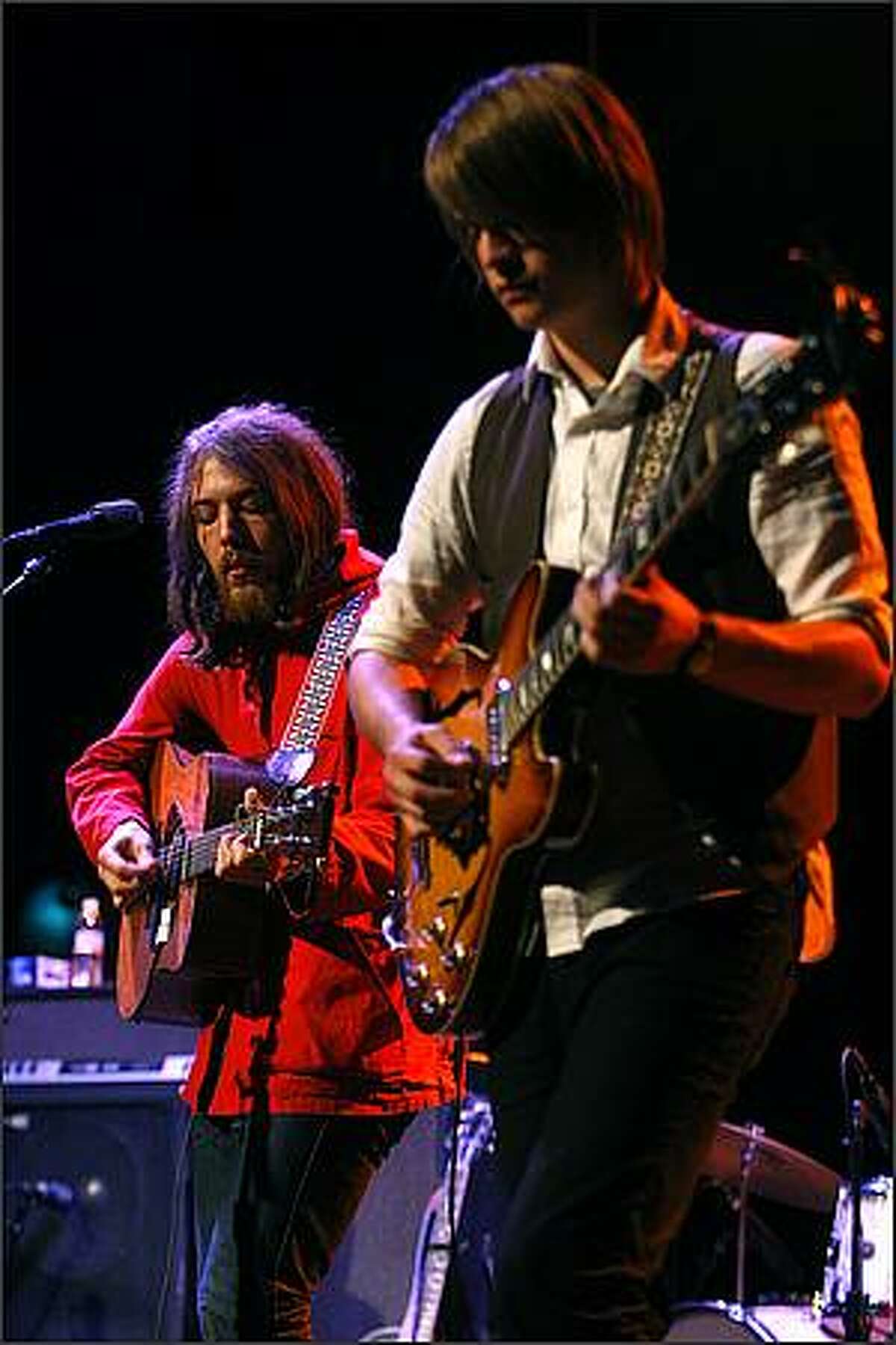 Robin Pecknold, left, and Skye Skjelset, of Fleet Foxes, perform at the Moore Theater in Seattle.