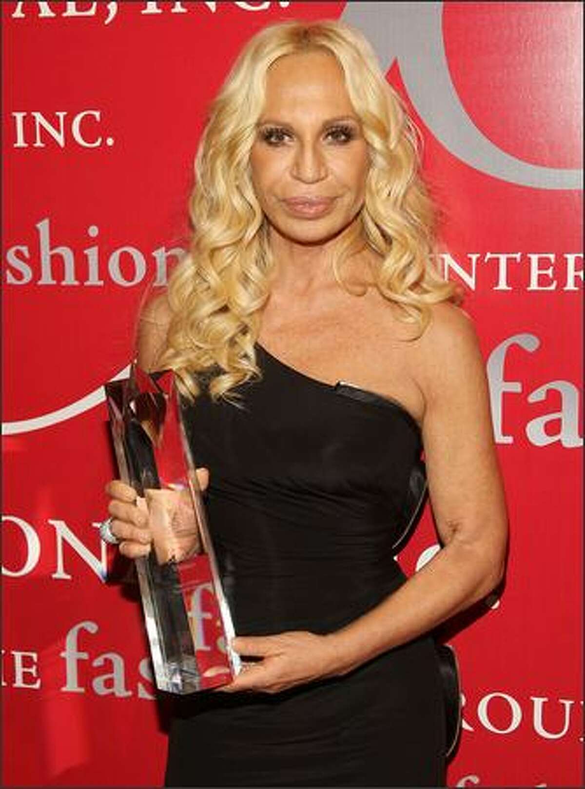 Designer Donatella Versace shows off her "Superstar Award."