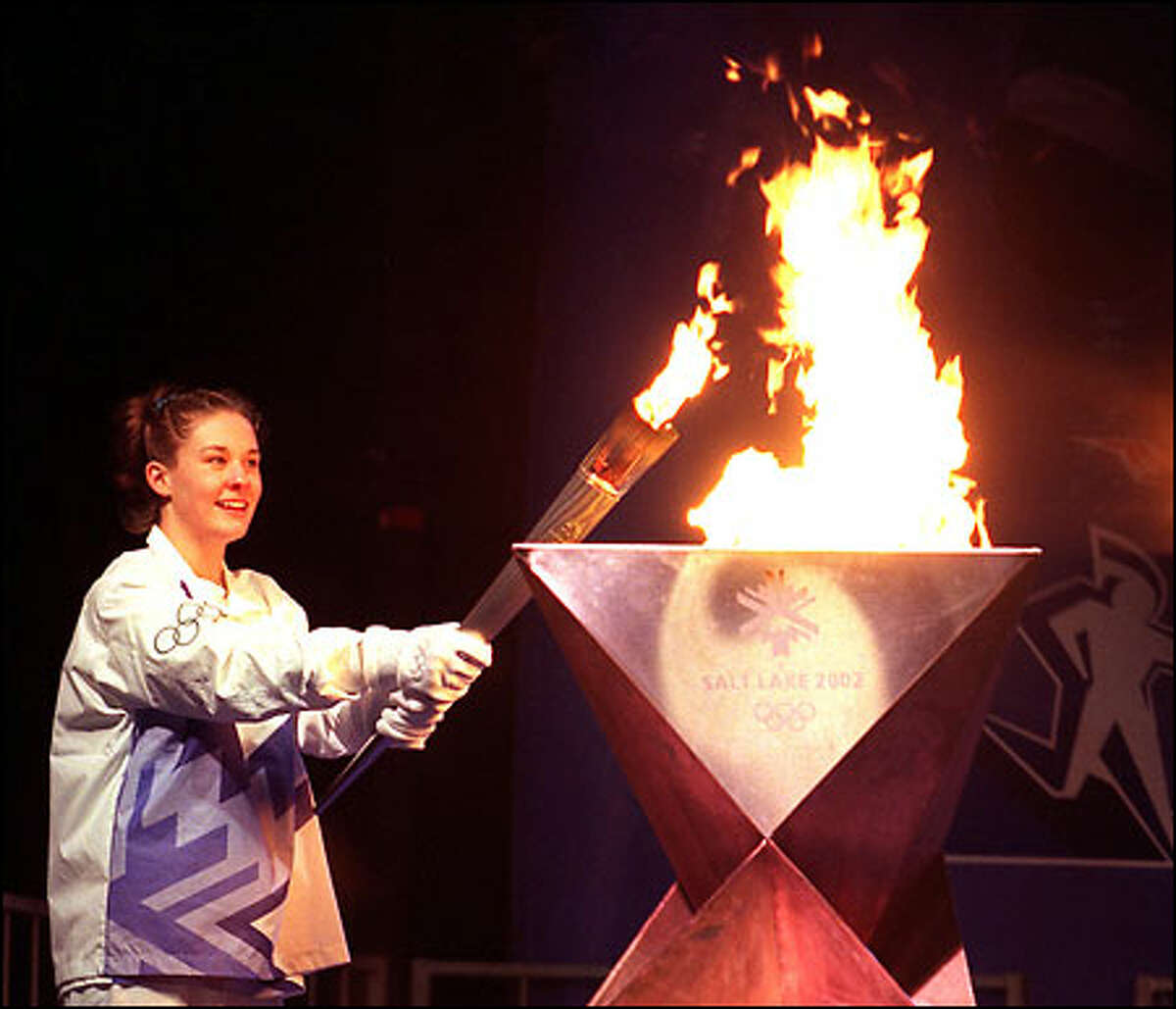 Megan Quann, a gold medalist in the 2002 Summer Games in Sydney, Australia, lit the Olympic flame at the Seattle Center on Jan. 23 prior to the running of the Torch Relay through the streets of Seattle.