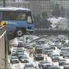 Two buses slid down the snow- and ice-covered East Thomas Street, hitting each other and then careening on through a guardrail on Melrose Avenue East, and finally stopping, 20 to 30 feet above Interstate 5.