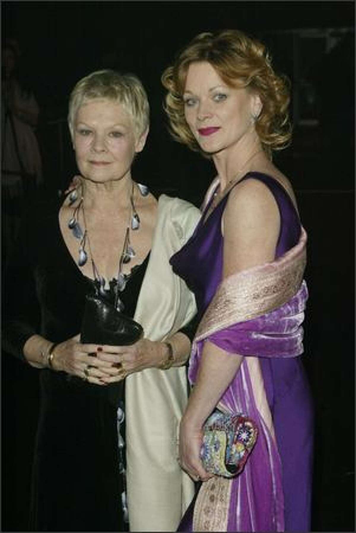 Actresses Dame Judi Dench and Samantha Bond at the after party for the World Premiere of the James Bond movie "Die Another Day" held in the "Bond Marquee" in Kensington Gardens, London, on November 18, 2002. Judi plays the role of "M" and Samantha plays "Miss Moneypenny" in the movie. (Getty Images)
