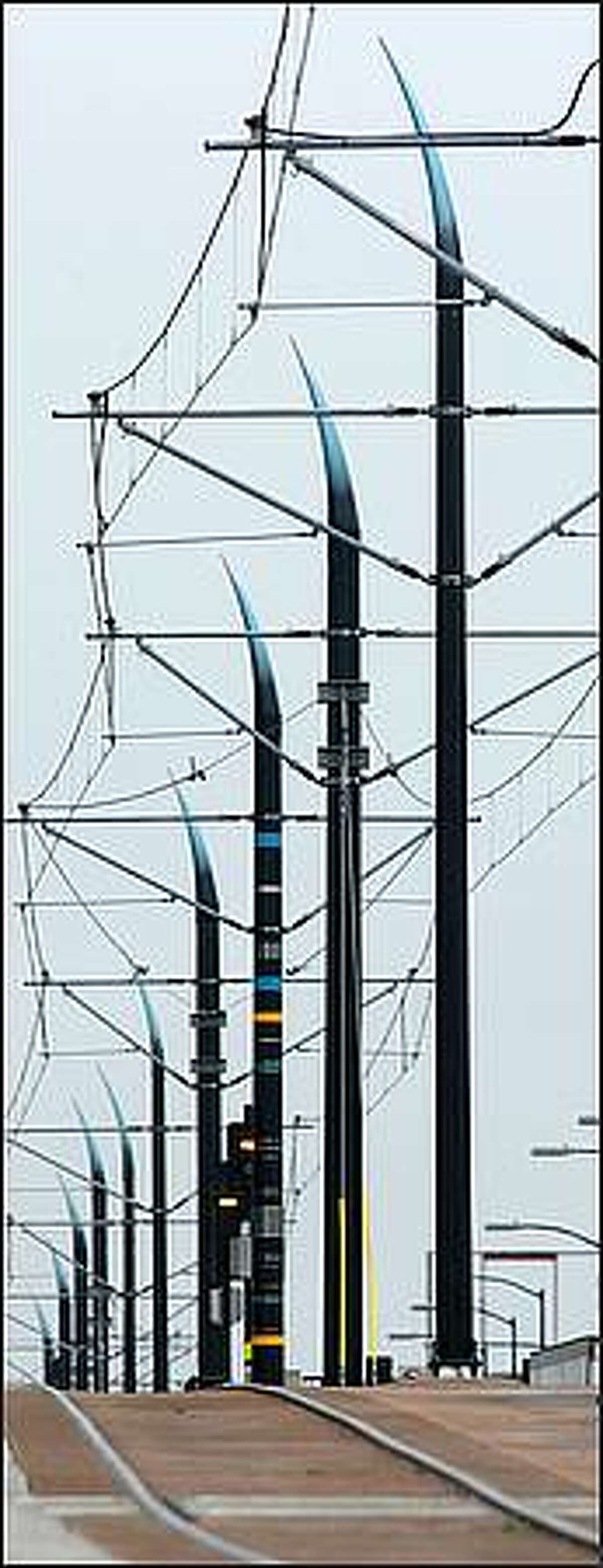Claw-like poles that support power lines along the Sound Transit Link light rail line. Thursday, Sept. 25, 2008.