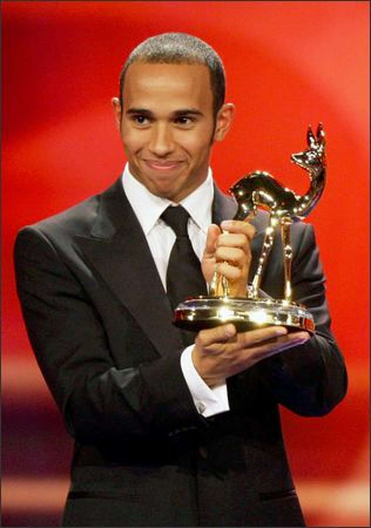 Formula One driver Lewis Hamilton recieves the Special Jury Bambi at the 60th Bambi Awards on Thursday in Offenburg, Germany. The awards ceremony takes place every year under the patronage of German publisher Hubert Burda and awards nominees in the sectors of communication, entertainment and show business as well as economy, politics and sports.