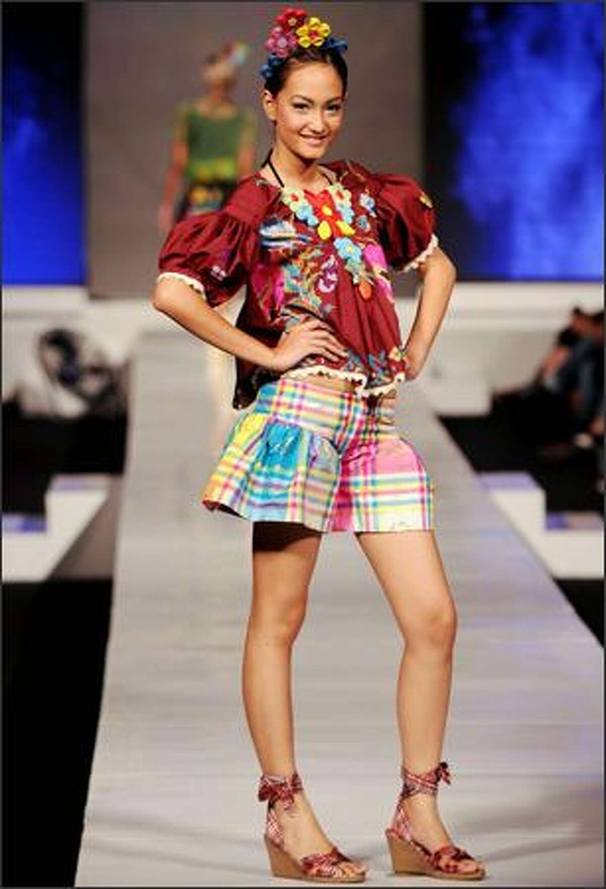 Indonesian models display ethnic outfits during Jakarta Fashion Week 2008, as part of the Jakarta tourism program in Jakarta on Thursday.