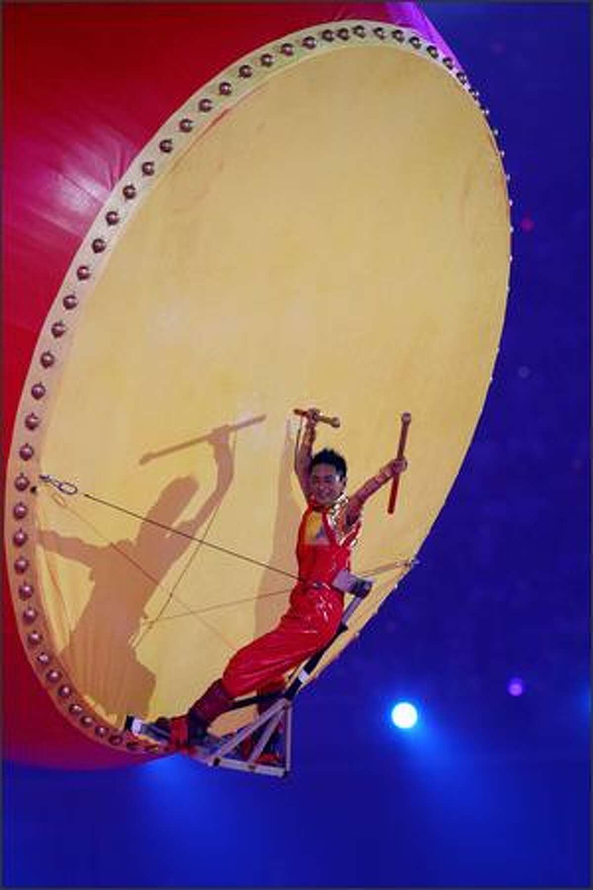 A musician plays a giant drum during the Closing Ceremony for the Beijing 2008 Olympic Games on Sunday in Beijing.