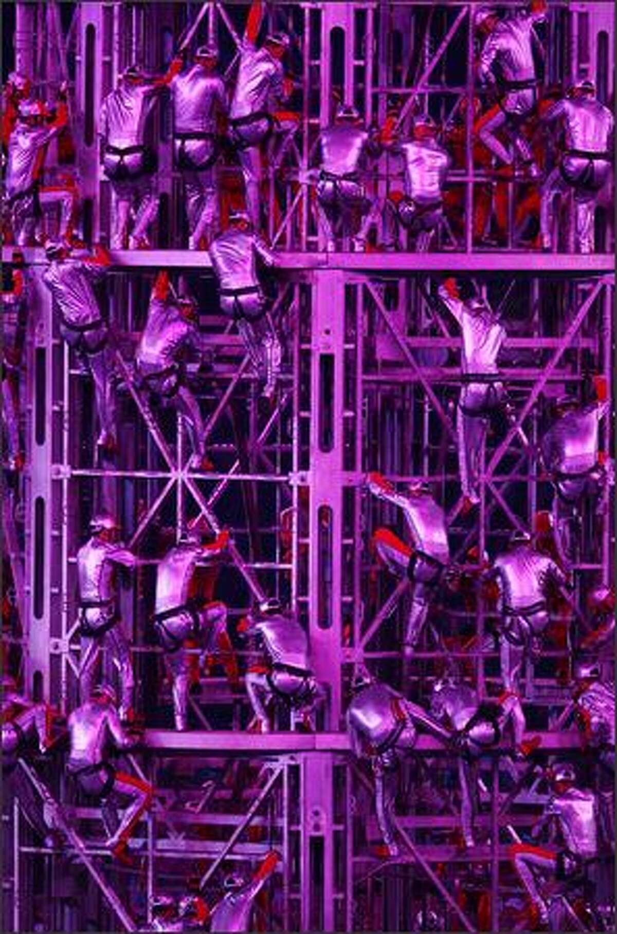Acrobats perform during the Closing Ceremony for the Beijing 2008 Olympic Games on Sunday in Beijing.