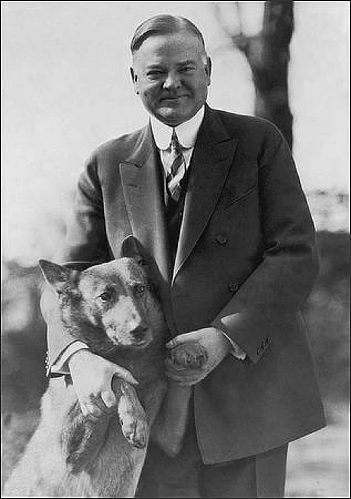 circa 1935: Herbert Hoover (1874 - 1964), the 31st President of the United States, with his dog. (Photo by Library Of Congress/Getty Images)
