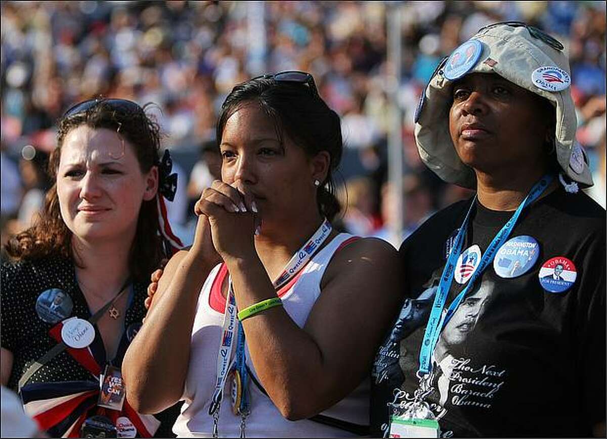 Jennifer Estroff (L), Kristine Reeves (C) and Sharon Winesberry, all of Washington State, listen to a speech by Martin Luther King, III on day four of the Democratic National Convention (DNC) at Invesco Field at Mile High in Denver, Colorado. U.S. Sen. Barack Obama (D-IL) is the first African-American to be officially nominated as a candidate for U.S. president by a major party.
