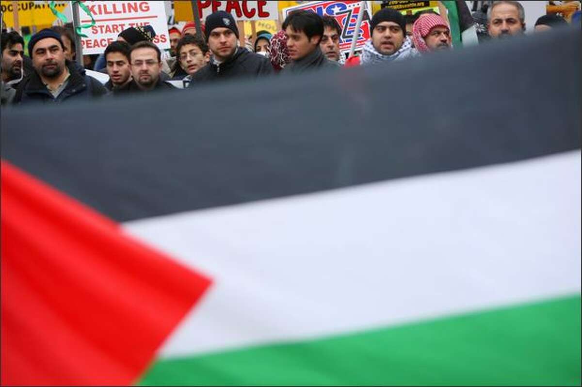 Supporters of Palestine march through downtown Seattle.