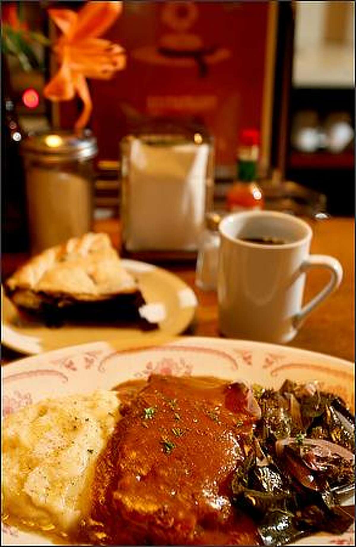 Classic comfort food from Hattie's Hat Restaurant in Ballard includes garlic mashed potatoes, meatloaf and braised greens with blueberry pie and coffee, Wednesday November 19, 2008.