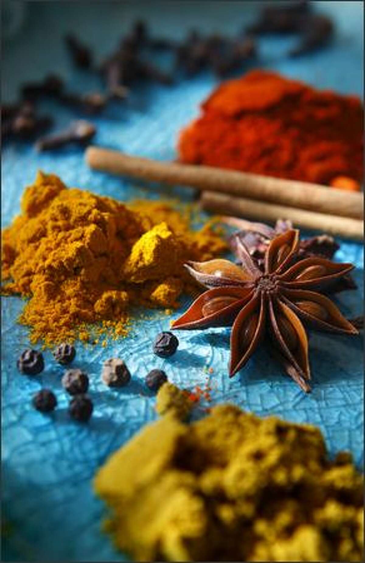 A display of spices created by Christina Arokiasamy includes, clockwise from bottom, garam masala, black pepper corns, cumin powder, cloves, turmeric, cinnamon and star anise.Rogers: This is just a celebration of texture, color and light that was kindly given to me by the chef.