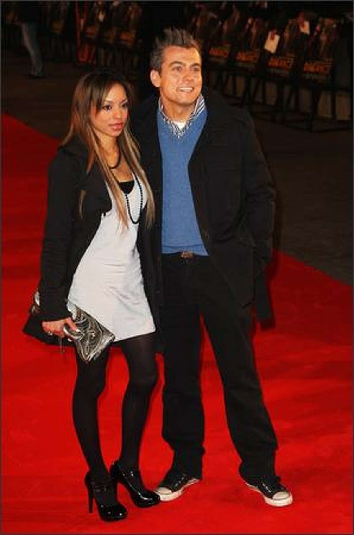 Paul Dana and guest arrive at the European Premiere of 'Defiance' at the Odeon West End cinema, Leicester Square on Tuesday in London, England.